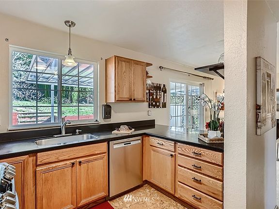 Kitchen overlooks the backyard and family room. 