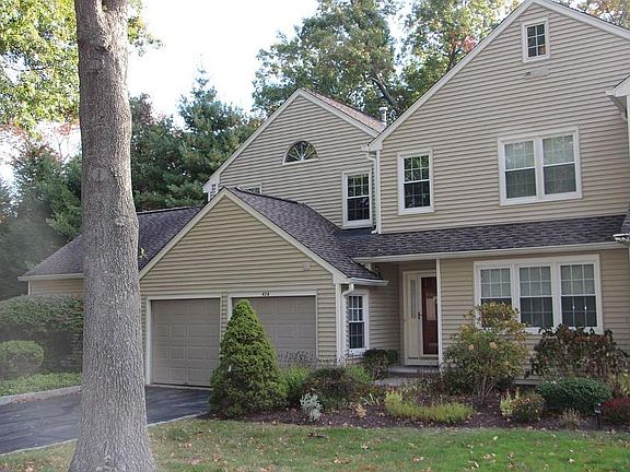 Condo front view, 2 car garage and private driveway