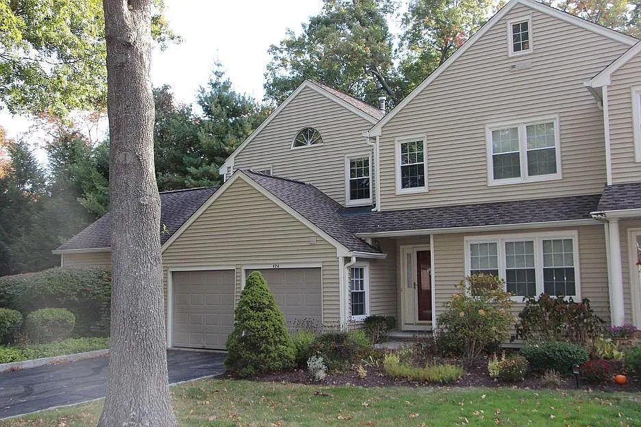 Condo front view, 2 car garage and private driveway