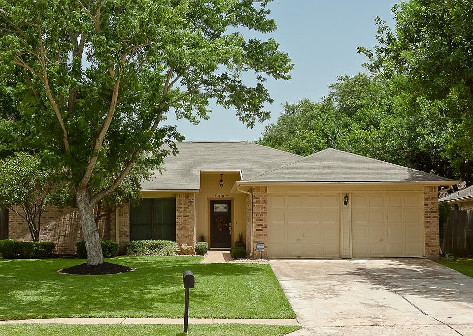 Meticulously maintained home situated on an over-sized lot features beautiful landscaping and mature