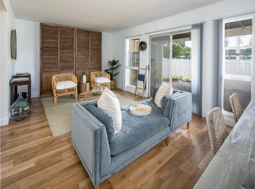Living room with private lanai. Photo from Kapilina Beach Homes