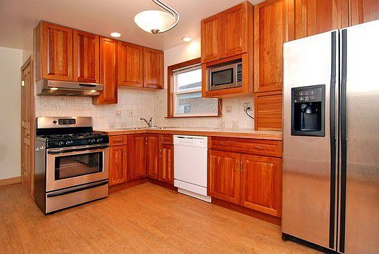 Cherry cabinets in kitchen.