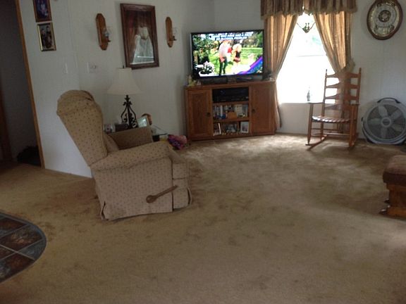 family room
						:
						Huge family room could not fit entire room in picture. Newer Carpet.