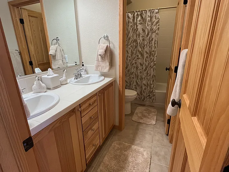 Downstairs bathroom with double sinks