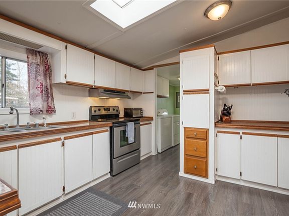 Spacious kitchen with a bright skylight and lots of cabinetry