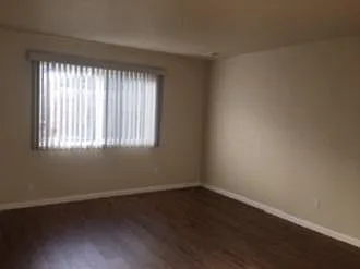 living room next to dining room - looks out to backyard