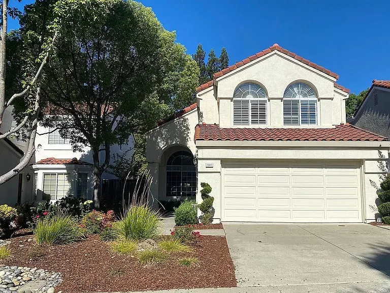 Front entry, driveway, and garage