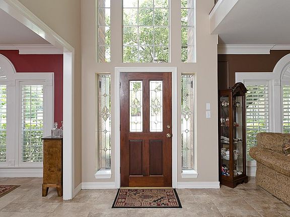 Huge foyer open to den room and formal dining room