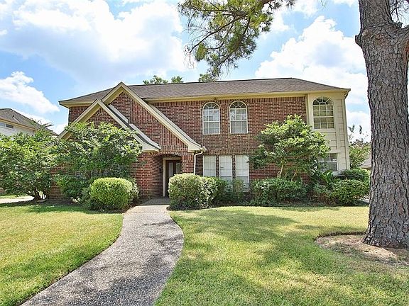 The brick exterior give this lovely two-story Torrey Chase home a stately feel.