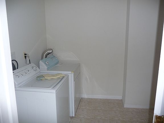large laundry room with machines included