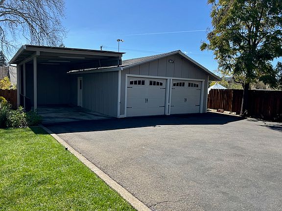 Detached 2-car garage with workshop inside plus RV parking