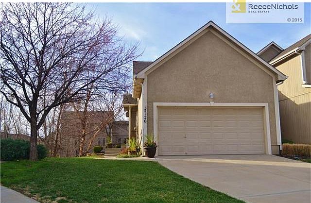 TWO CAR GARAGE AND PRIVATE, SIDE ENTRY