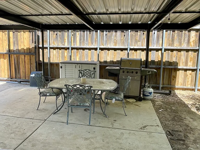 backyard covered porch, grill, outdoor furniture