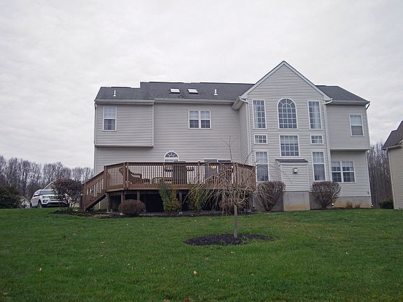 View of rear of home and deck