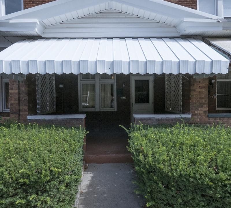 Brick townhouse, front porch.