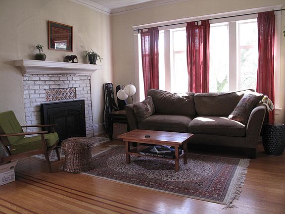 Living room in front of house. Gas fireplace.