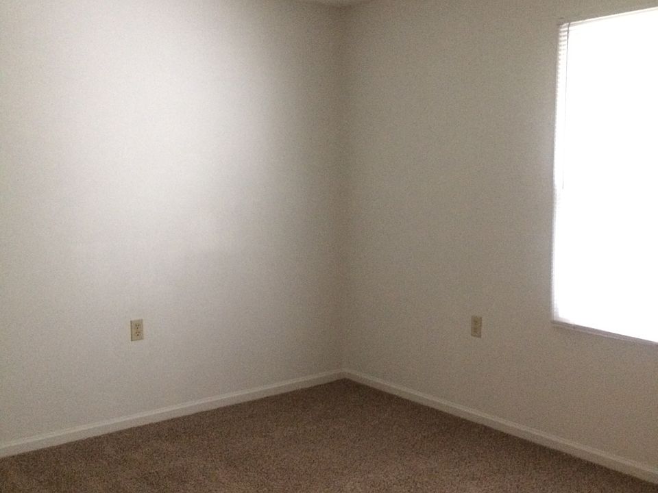 Bedroom with window and closet.