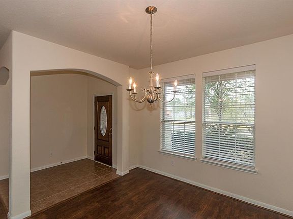 The dining room is light and bright with a nice view of the front yard.