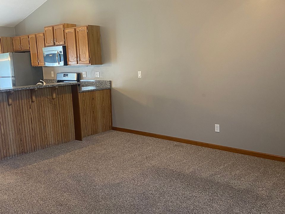 Main floor living room with open concept view into kitchen