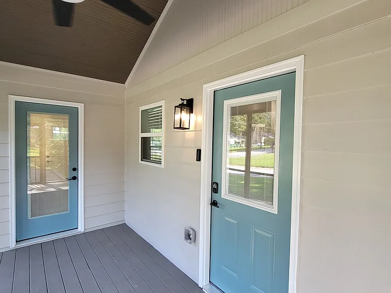 Screened-in porch -- door to office on left and door to kitchen (with keyless entry deadbolt) on right.