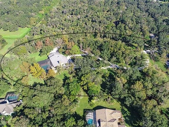 Over 5 acres of privacy and natural beauty conveniently located to SR-64 and I-75.