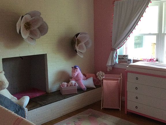 Bedroom featuring fireplace