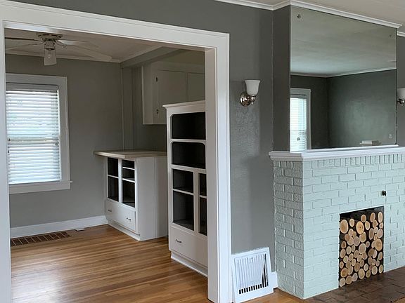 The dining room features built in shelving original to the home.