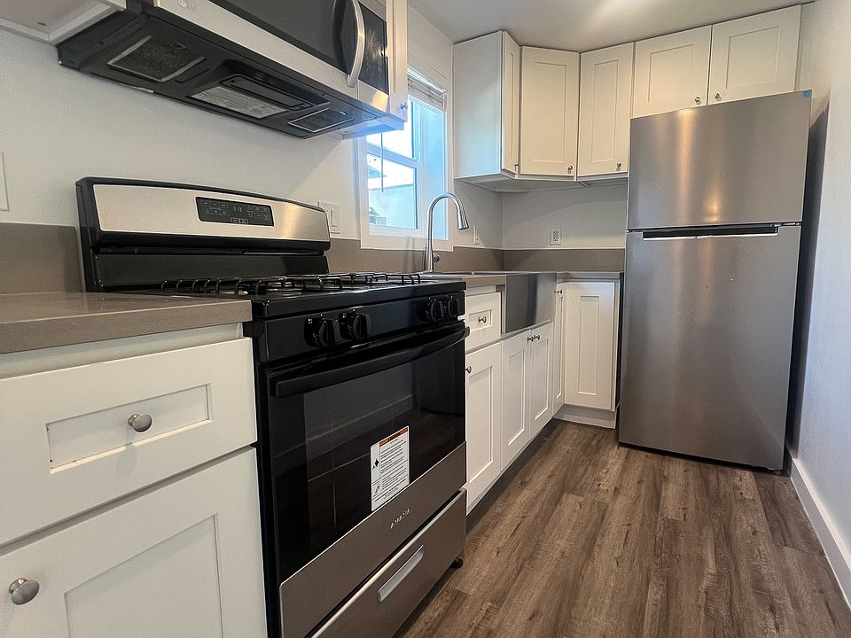 Modern kitchen with new stainless steel appliances included