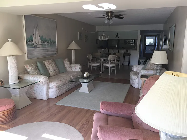 Your view from lake side of main living area with kitchen next to the entrance.