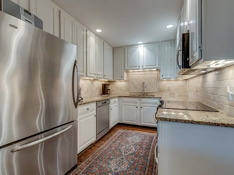 Stainless and granite kitchen - including microwave and disposal in double sink with sprayer and soap dispenser