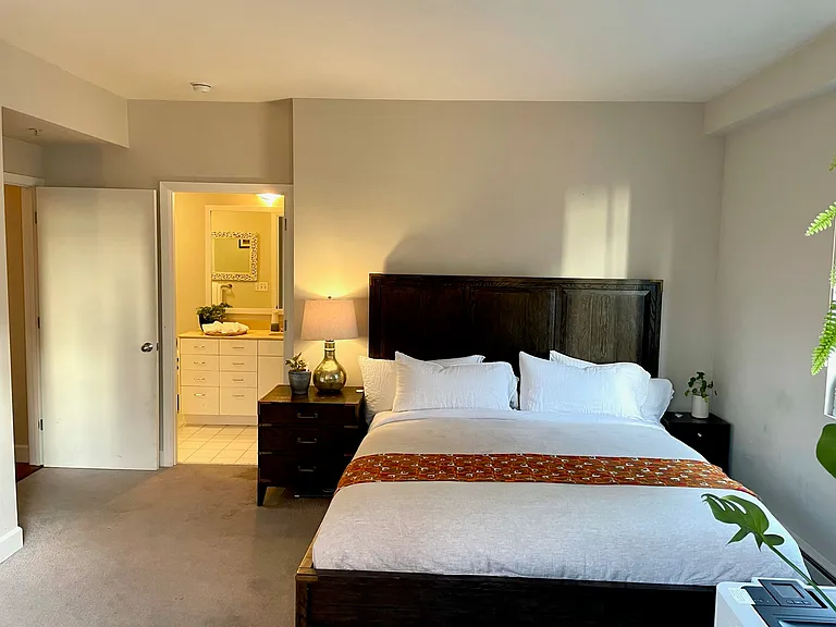 Primary bedroom with en-suite bath access and generous room depth.