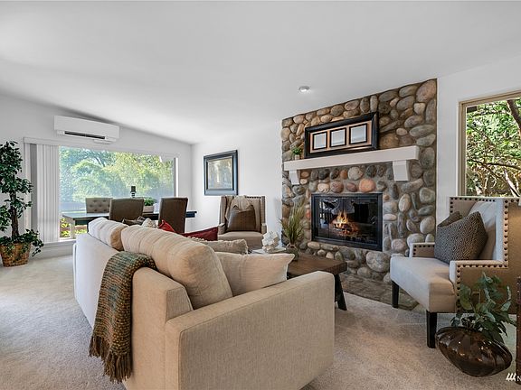 The living and dining rooms are open to one another so you can easily expand or contract each space depending on your entertaining needs! Notice the vaulted ceiling, fresh carpet and the super-efficient, Daikin brand mini-split system that provides heating and cooling: new in 2020.>