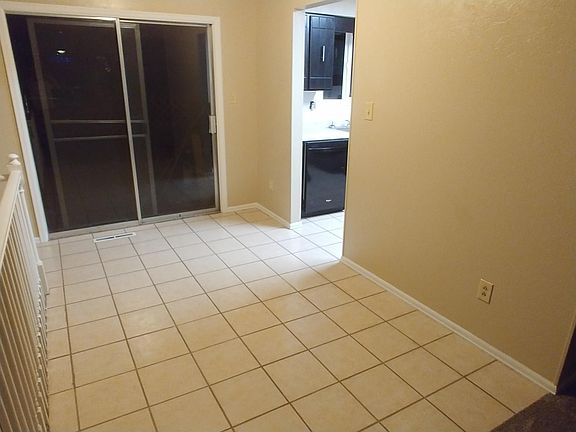 Dining room with tile floor and walkout to deck