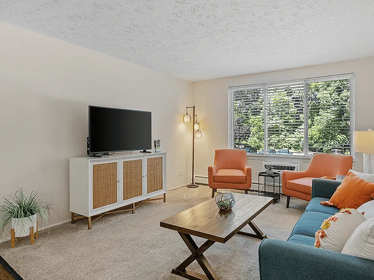 Carpeted Living Room with Large Window