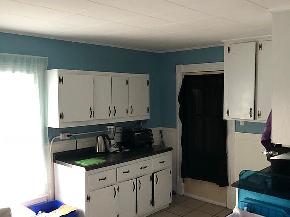 Lots of storage space and new countertops in the freshly painted kitchen.