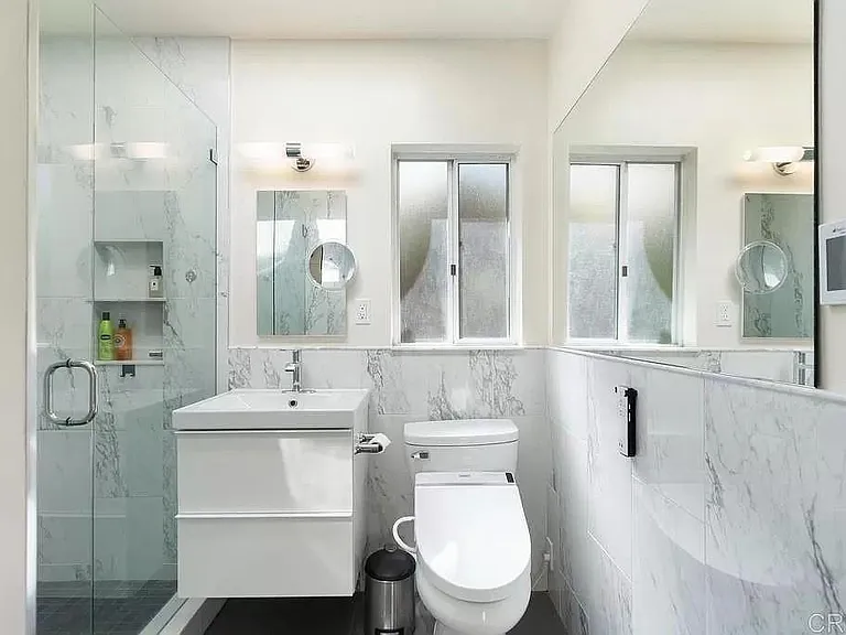 Bathroom with TOTO toilet.