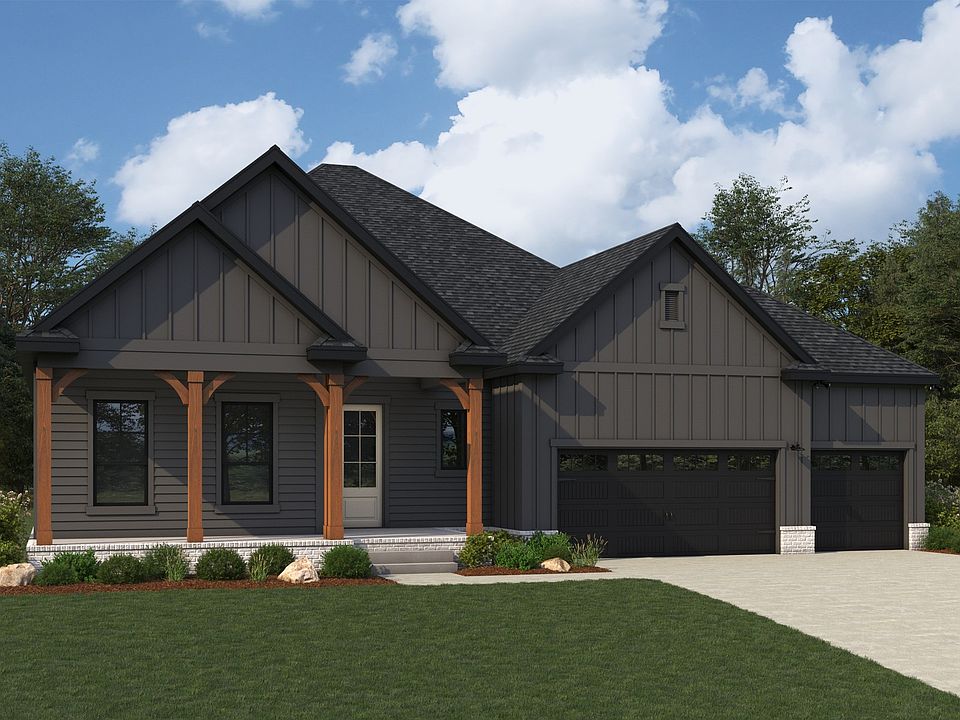 This Brush Creek home showcases sleek black siding with wooden accents and a charming gable roof.