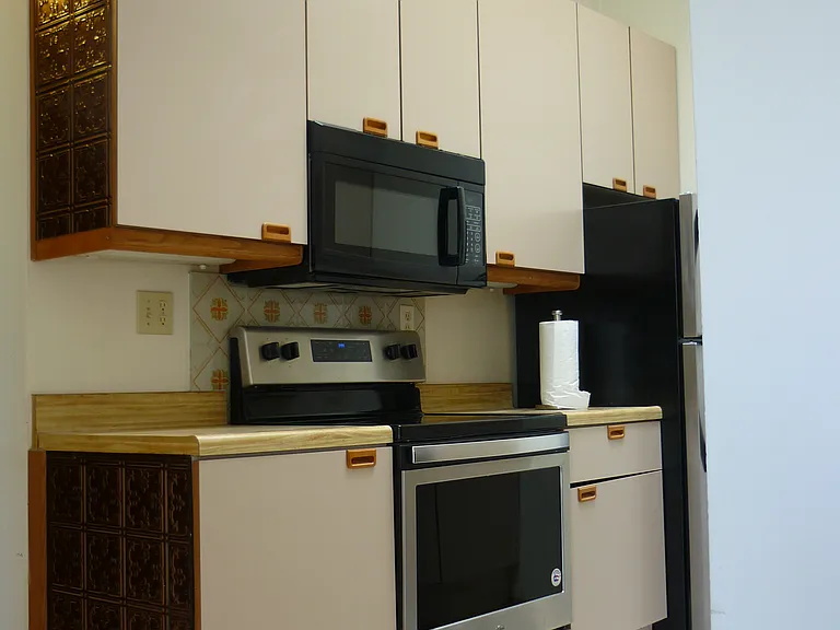 View of kitchen, looking southeast