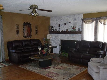 Living Room opens to Kitchen; Sliding doors lead to upper deck