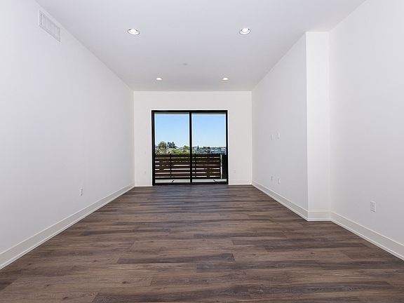 Dining and Living Room Space with Recessed Lighting, Vinyl Flooring, and Patio