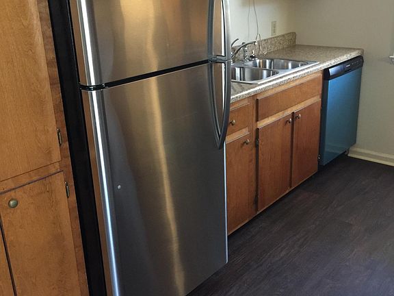 Brand new Frigidaire refrigerator. Luxury Vinyl Tile