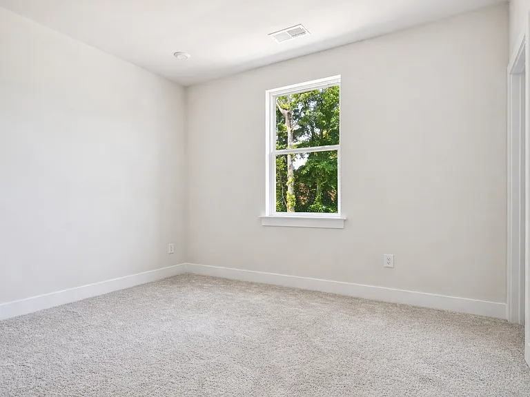 Bright second bedroom with window