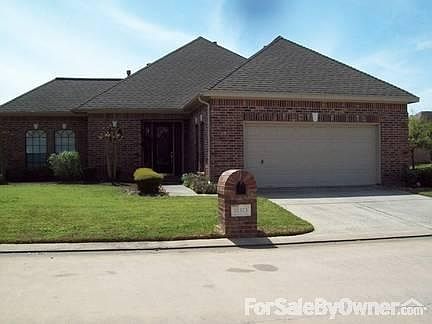 Street View : Notice the beautiful front door! All brick home