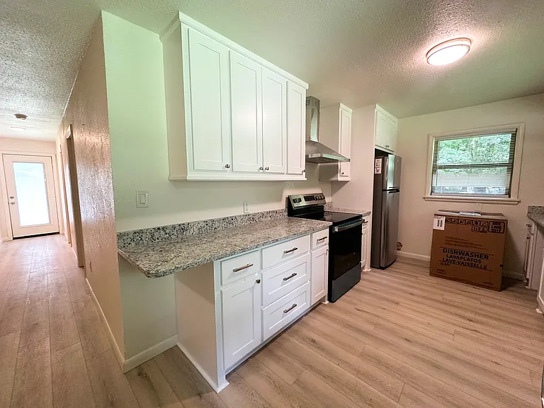 Brand new kitchen. New flooring throughout