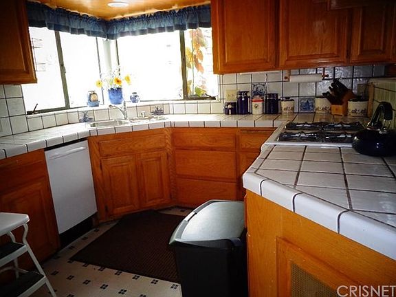 Loads ofcabinets plus wood floors under the linoleum.