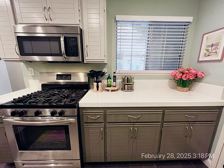 New Gas Range and Microwave, plus Air Fryer, Blender, and Toaster (not pictured), Full Spice Rack, Premium Condiments, and Complete Cookware & Utensils perfect for quick and easy meals.