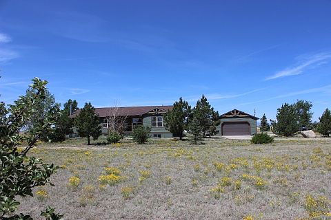 Front view with over sized detached garage