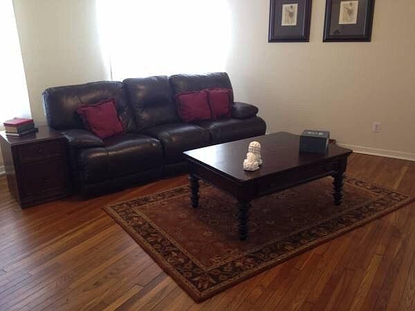 Living area with brand new leather sofa