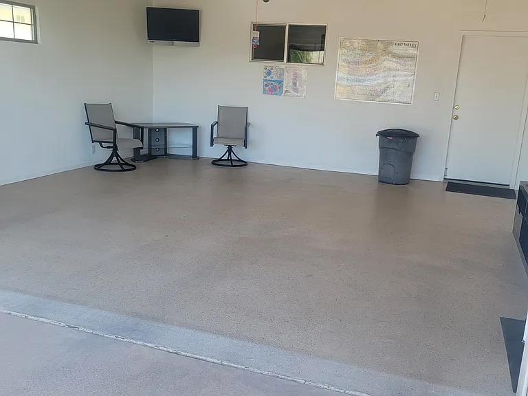 A 2-car garage with a tv with streaming service.