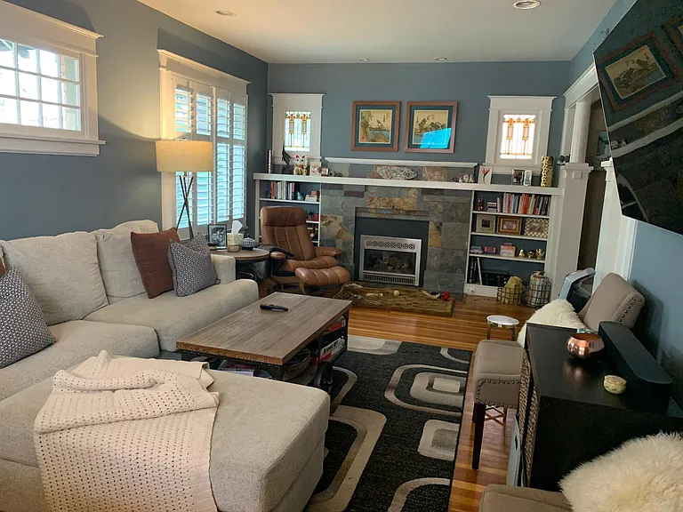 original hardwood floors, plantation shutters, gas fireplace